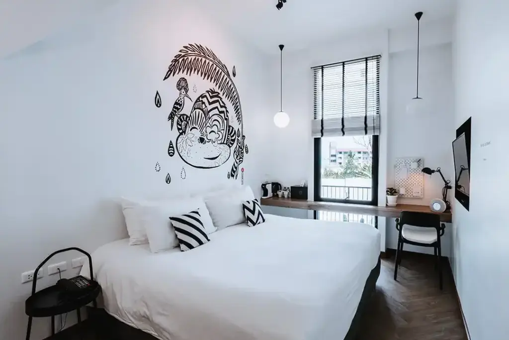 Guest room with rain-inspired wall art at Blu Monkey Hub & Hotel Ranong